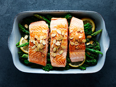 Baked salmon with broccolini and almonds